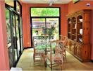 Bright dining room with large windows and garden view