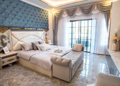 Luxurious bedroom with elegant design and ample lighting