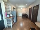 Modern kitchen with open dining area and wooden flooring