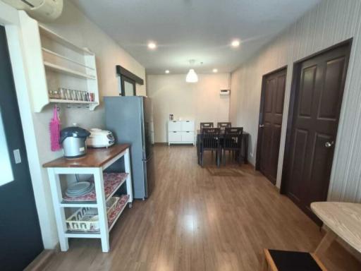 Modern kitchen with open dining area and wooden flooring