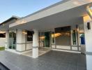 Modern home exterior with a spacious porch and sliding glass doors