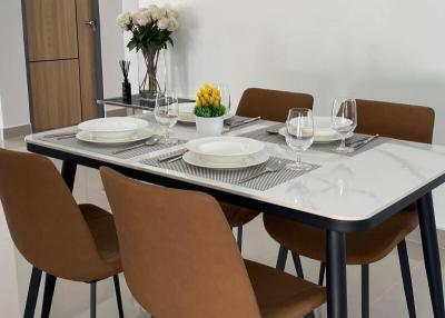 Modern dining room with table set for four