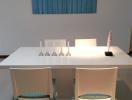 Modern dining room with white table and art piece