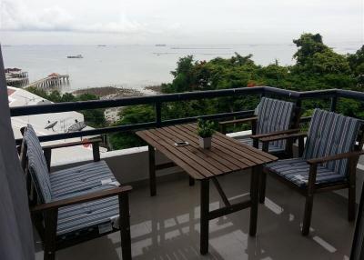 Spacious balcony with outdoor furniture and sea view