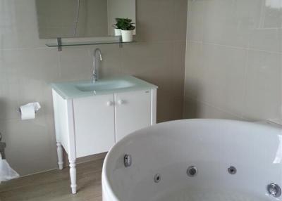 Modern bathroom interior with a corner whirlpool tub and walk-in shower