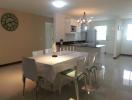 Modern kitchen with dining area and polished floor