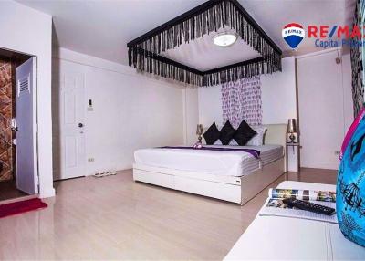 Spacious bedroom with king-sized bed and modern decor