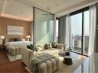 Elegant bedroom with large windows and ample natural light