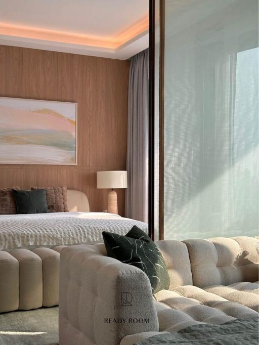 Modern bedroom with comfortable bedding and soft lighting