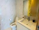 Modern bathroom with marble tiles and sleek fixtures