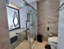 Modern bathroom with glass shower and stylish fixtures