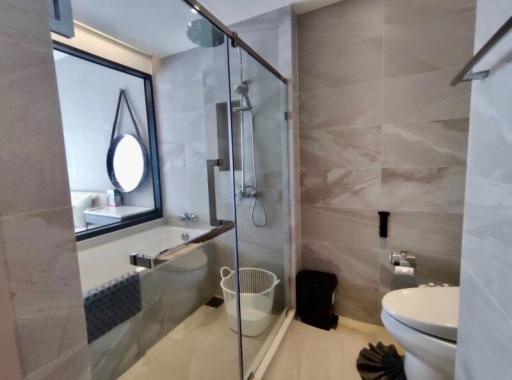 Modern bathroom with glass shower and stylish fixtures