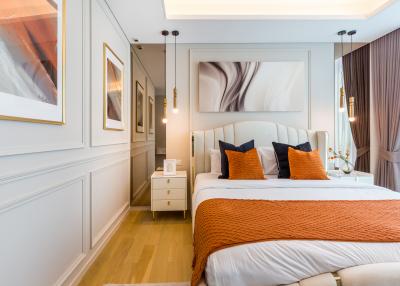 Elegant bedroom with modern decor and artwork