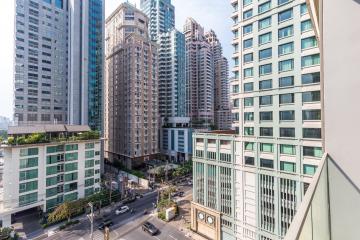 High-rise cityscape view from a balcony showcasing urban living