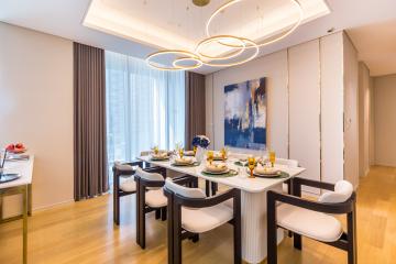 Modern dining room with stylish decor and ample lighting