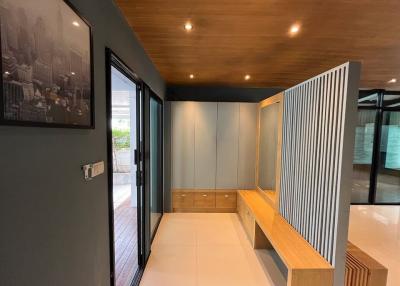 Modern hallway interior with wooden seating and storage cabinets