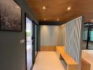 Modern hallway interior with wooden seating and storage cabinets