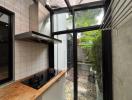 Cozy kitchen corner with natural light and garden view