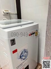 Compact laundry room with modern washing machine