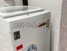 Compact laundry room with modern washing machine