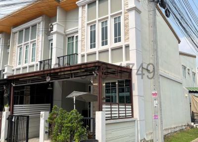 Two-story residential building with external electrical pole obstructing view