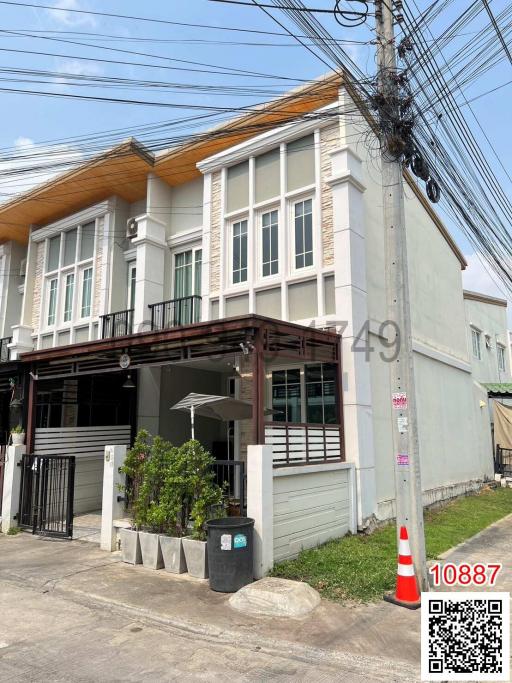 Two-story residential building with external electrical pole obstructing view