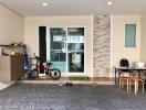 Spacious garage with children's bicycle and a storage shelf