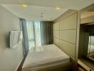 Modern bedroom with large bed and built-in wardrobes