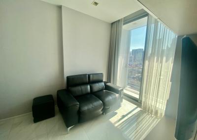 Modern living room with large windows and city view