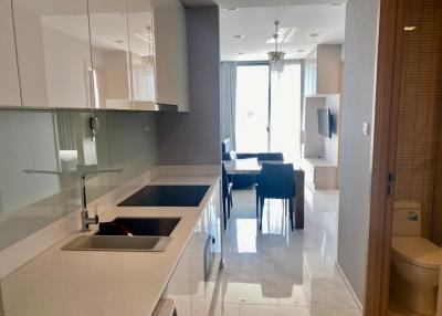 Modern kitchen with a view into the dining area and natural light