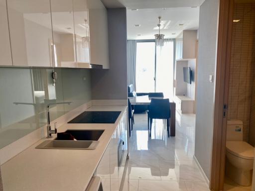 Modern kitchen with a view into the dining area and natural light