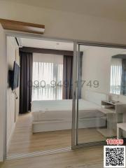 Modern bedroom with glass sliding door and balcony access