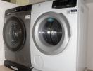 Modern appliances in a laundry room with a Toshiba and Electrolux washer and dryer