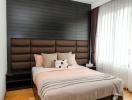 Modern bedroom with a large bed and stylish decor