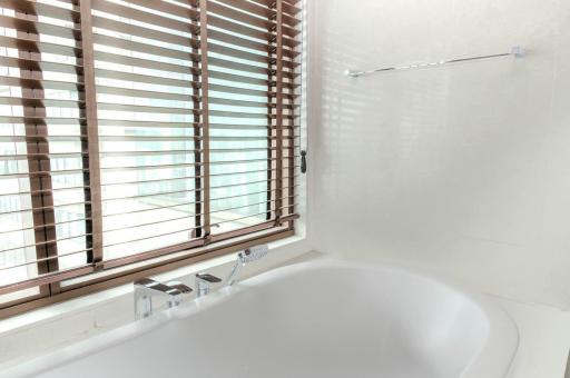 Modern bathroom with natural light and bathtub