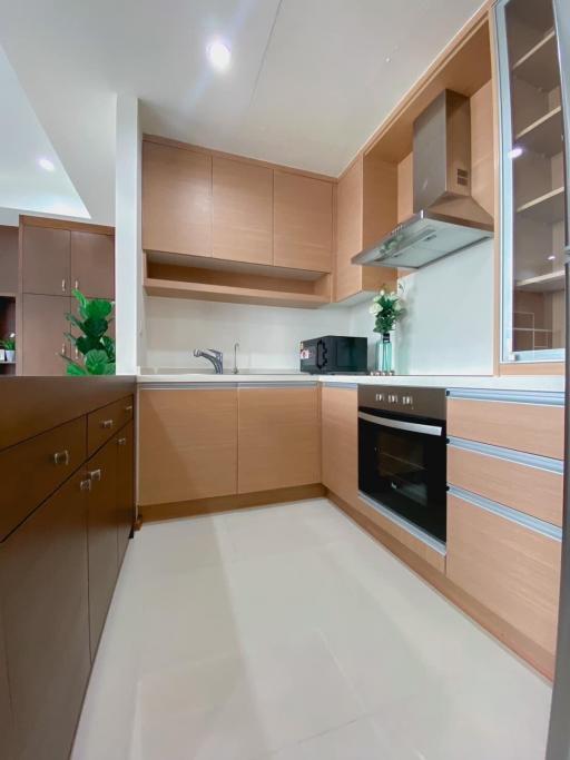Modern kitchen with built-in appliances and ample cabinetry