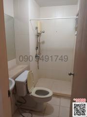 Compact bathroom with shower and toilet