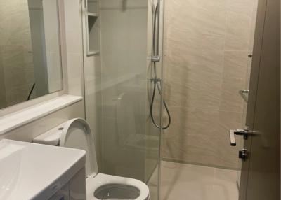 Modern bathroom with toilet and walk-in shower