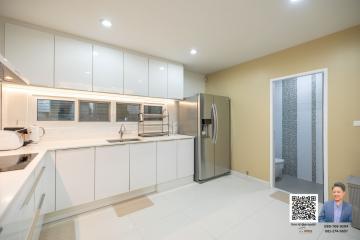 Modern kitchen with stainless steel appliances and white cabinetry