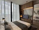Modern bedroom with expansive windows and attached living area