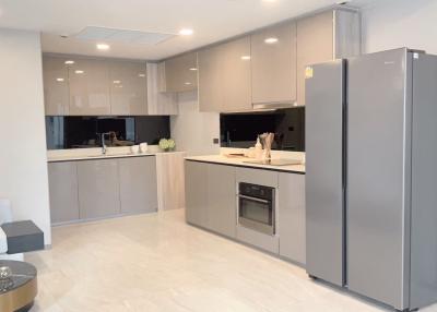 Modern kitchen with stainless steel appliances and open floor plan