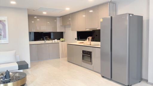 Modern kitchen with stainless steel appliances and open floor plan