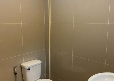 Bright tidy bathroom with toilet and bidet