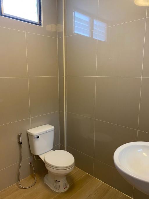 Bright tidy bathroom with toilet and bidet