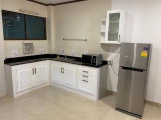 Modern kitchen with stainless steel appliances and white cabinetry