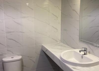 Modern bathroom interior with marble tiles