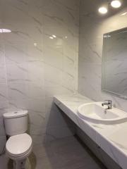 Modern bathroom interior with marble tiles