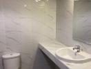 Modern bathroom interior with marble tiles