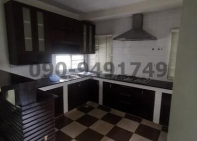 Modern kitchen with black and white checkered floor