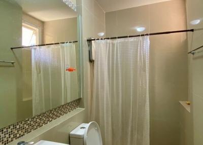Modern bathroom interior with tiled walls and flooring